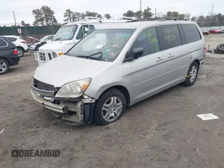 2005 Honda Odyssey EX with VIN 5FNRL38435B071998, listed as a IAAI auction lot 41808601 with 999,999 mi miles. Bid and sale history available at carsss.com. Image 2.