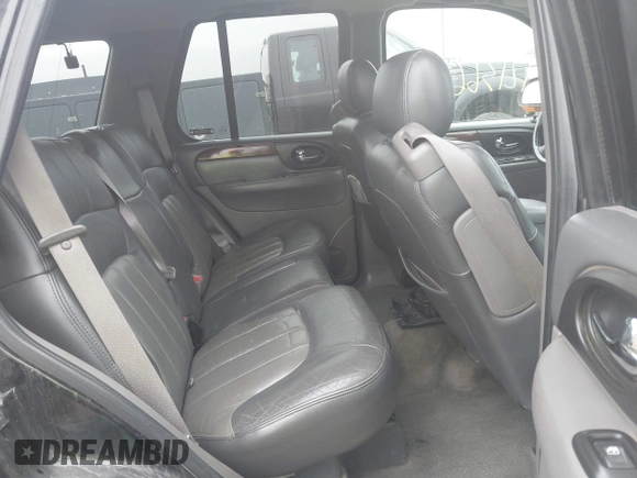 2002 GMC Envoy SLT with VIN 1GKDT13S222143135, listed as a IAAI auction lot 42136672 with 206,064 mi miles. Bid and sale history available at carsss.com. Image 8.