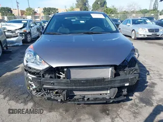 2016 Hyundai Veloster z VIN KMHTC6AD1GU286674, wystawiony jako IAAI lot #41627128 z przebiegiem 71 617 mil mil oraz . Historia ofert i sprzedaży dostępna na DreamBid. Obrazek 13.