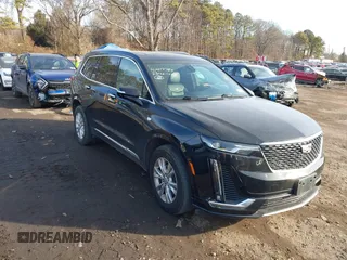2023 Cadillac XT6 AWD Luxury with VIN 1GYKPBR41PZ136918, listed as a IAAI auction lot 41417724 with 57,949 mi miles. Bid and sale history available at carsss.com. Image 1.