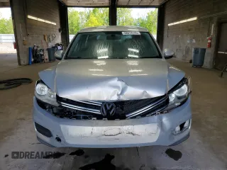 2013 Volkswagen Tiguan S with VIN WVGAV3AX9DW626065, listed as a Copart auction lot 58014145 with 128,858 mi miles and Salvage title. Bid and sale history available at DreamBid. Image 5.