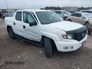 2014 Honda Ridgeline Sport z VIN 5FPYK1F7XEB009702, wystawiony jako IAAI lot #41612581 z przebiegiem 113 377 mil mil oraz . Historia ofert i sprzedaży dostępna na DreamBid. Obrazek 1.