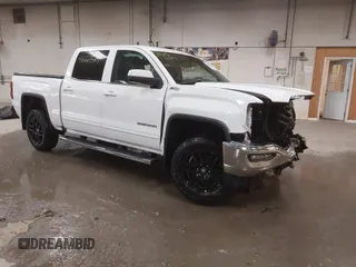 2018 GMC Sierra 1500 SLE z VIN 3GTU2MEC3JG327687, wystawiony jako IAAI lot #41666524 z przebiegiem 89 647 mil mil oraz . Historia ofert i sprzedaży dostępna na DreamBid. Obrazek 1.