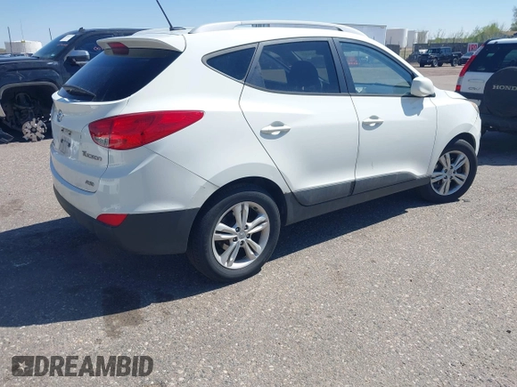 2011 Hyundai Tucson Limited with VIN KM8JUCAC0BU206509, listed as a IAAI auction lot 42034266 with 185,989 mi miles and . Bid and sale history available at DreamBid. Image 4.