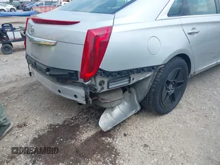 2014 Cadillac XTS Luxury z VIN 2G61N5S38E9270619, wystawiony jako IAAI lot #40140617 z przebiegiem 117 286 mil mil oraz . Historia ofert i sprzedaży dostępna na DreamBid. Obrazek 6.