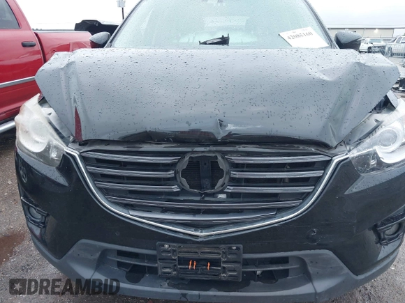 2016 Mazda CX-5 Grand Touring z VIN JM3KE4DY9G0605489, wystawiony jako IAAI lot #42085160 z przebiegiem 160 338 mil mil oraz . Historia ofert i sprzedaży dostępna na DreamBid. Obrazek 6.