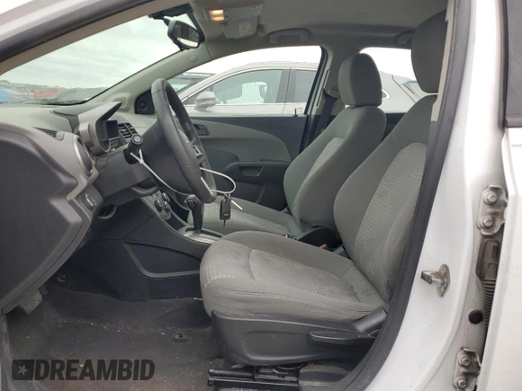 2015 Chevrolet Sonic LS with VIN 1G1JA5SH4F4165108, listed as a Copart auction lot 57299985 with 117,669 mi miles and Clean title. Bid and sale history available at DreamBid. Image 7.