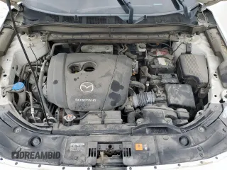 2020 Mazda CX-5 Touring z VIN JM3KFACM6L0787687, wystawiony jako Copart lot #57639555 z przebiegiem 91 219 mil mil oraz Szkoda całkowita • Salvage title. Historia ofert i sprzedaży dostępna na DreamBid. Obrazek 12.