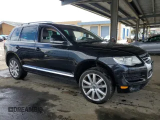 2010 Volkswagen Touareg VR6 with VIN WVGBF7A98AD001321, listed as a Copart auction lot 48949685 with 101,944 mi miles and Salvage Title. Bid and sale history available at DreamBid. Image 4.