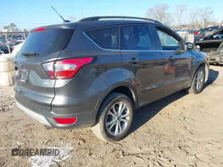 2018 Ford Escape SE with VIN 1FMCU0GD0JUA87303, listed as a IAAI auction lot 41612502 with 70,233 mi miles. Bid and sale history available at carsss.com. Image 4.