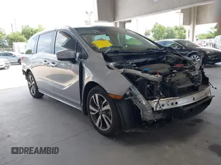 2022 Honda Odyssey Touring z VIN 5FNRL6H83NB021400, wystawiony jako IAAI lot #42539617 z przebiegiem 67 294 mil mil oraz . Historia ofert i sprzedaży dostępna na DreamBid. Obrazek 1.