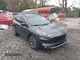 2020 Ford Escape SE Sport Hybrid with VIN 1FMCU0BZ7LUB13398, listed as a IAAI auction lot 41942498 with 118,604 mi miles and . Bid and sale history available at DreamBid. Image 1.