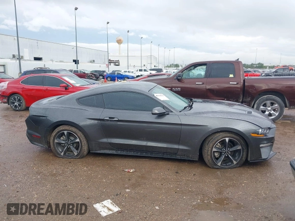 2018 Ford Mustang EcoBoost z VIN 1FA6P8TH2J5184485, wystawiony jako IAAI lot #41884810 z przebiegiem 74 999 mil mil oraz . Historia ofert i sprzedaży dostępna na DreamBid. Obrazek 13.