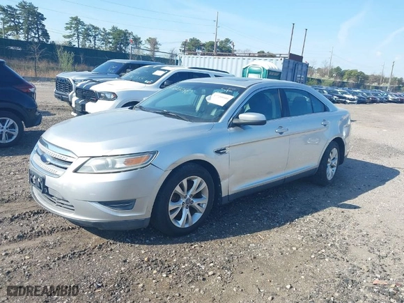 2010 Ford Taurus SEL with VIN 1FAHP2EW2AG107489, listed as a IAAI auction lot 39206067 with 128135 miles. Bid and sale history available at carsss.com. Image 2.
