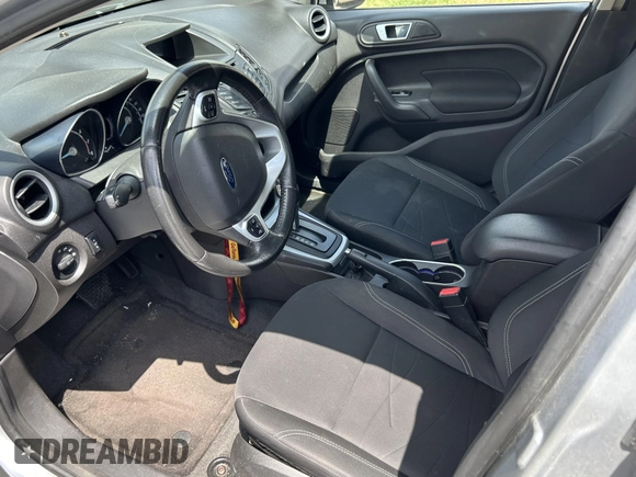 2015 Ford Fiesta SE z VIN 3FADP4EJ8FM167515, wystawiony jako IAAI lot #42153873 z przebiegiem 100 559 mil mil oraz . Historia ofert i sprzedaży dostępna na DreamBid. Obrazek 5.