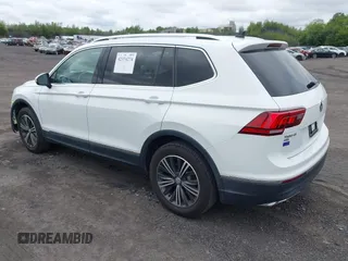 2018 Volkswagen Tiguan SEL with VIN 3VV2B7AX7JM099570, listed as a IAAI auction lot 42374274 with 87,838 mi miles and . Bid and sale history available at DreamBid. Image 3.
