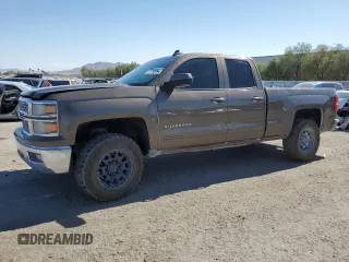 2015 Chevrolet Silverado 1500 LT with VIN 1GCRCREC2FZ388049, listed as a Copart auction lot 76098054 with 131,051 mi miles and Salvage Title. Bid and sale history available at DreamBid. Image 1.