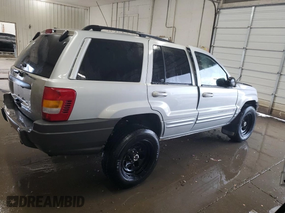 2002 Jeep Grand Cherokee Limited z VIN 1J8GW58S02C279251, wystawiony jako Copart lot #61563465 z przebiegiem 182 244 mil mil oraz Szkoda całkowita • Salvage title. Historia ofert i sprzedaży dostępna na DreamBid. Obrazek 3.