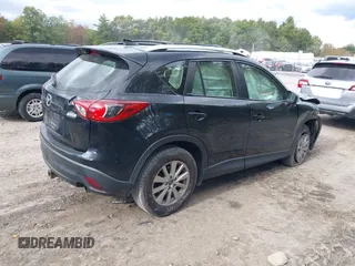2016 Mazda CX-5 Sport with VIN JM3KE2BE8G0804398, listed as a IAAI auction lot 40490953 with 116,279 mi miles and . Bid and sale history available at DreamBid. Image 4.