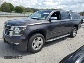 2015 Chevrolet Suburban LTZ with VIN 1GNSCKKCXFR216890, listed as a Copart auction lot 52695155 with 233,296 mi miles and Clean Title. Bid and sale history available at DreamBid. Image 1.