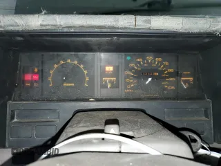 1987 Nissan Hardbody E z VIN JN6ND11S3HW057122, wystawiony jako Copart lot #73303004 z przebiegiem 233 309 mil mil oraz Szkody całkowita. Historia ofert i sprzedaży dostępna na DreamBid. Obrazek 9.