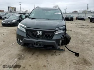 2021 Honda Passport Elite with VIN 5FNYF8H03MB027396, listed as a Copart auction lot 84208414 with 56,641 mi miles and Salvage Title. Bid and sale history available at carsss.com. Image 12.