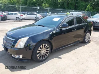 2011 Cadillac CTS Premium with VIN 1G6DS5ED4B0105859, listed as a IAAI auction lot 42494741 with 143,128 mi miles and . Bid and sale history available at DreamBid. Image 2.