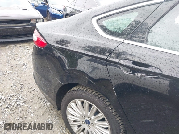 2016 Ford Fusion Energi SE Luxury with VIN 3FA6P0PU7GR293099, listed as a IAAI auction lot 42079873 with 194,755 mi miles. Bid and sale history available at carsss.com. Image 6.