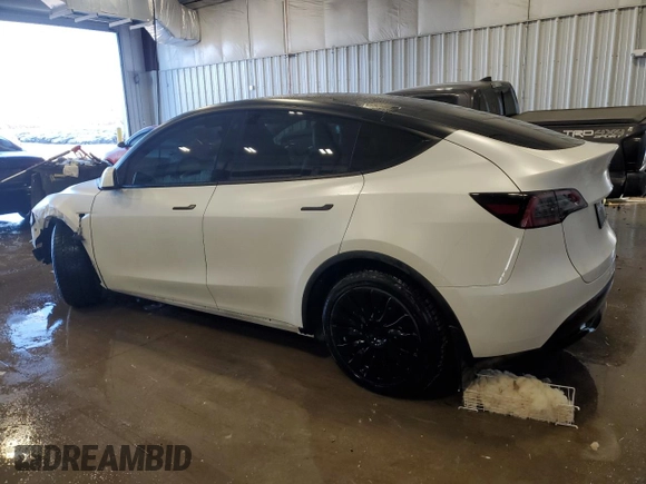 2023 Tesla Model Y Long Range z VIN 7SAYGAEE5PF672546, wystawiony jako Copart lot #42779065 z przebiegiem 27 570 mil mil oraz Nie do naprawy • Non repairable. Historia ofert i sprzedaży dostępna na DreamBid. Obrazek 2.
