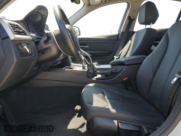 2014 BMW 3 Series 320i with VIN WBA3B1C55EK133687, listed as a Copart auction lot 63049945 with 95,604 mi miles and Salvage title. Bid and sale history available at DreamBid. Image 7.