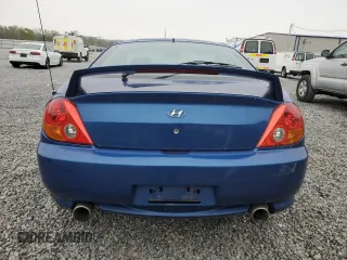 2004 Hyundai Tiburon GT z VIN KMHHN65F04U116166, wystawiony jako Copart lot #51525065 z przebiegiem 153 035 mil mil oraz Szkody całkowita. Historia ofert i sprzedaży dostępna na DreamBid. Obrazek 6.
