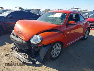 2019 Volkswagen Beetle S with VIN 3VWFD7AT7KM719940, listed as a IAAI auction lot 41190839 with 77,627 mi miles. Bid and sale history available at carsss.com. Image 2.
