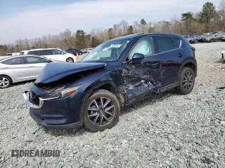 2018 Mazda CX-5 Grand Touring z VIN JM3KFBDM3J0301080, wystawiony jako Copart lot #49290545 z przebiegiem Nie podano mil oraz Szkody całkowita. Historia ofert i sprzedaży dostępna na DreamBid. Obrazek 1.