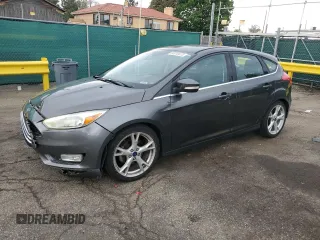 2016 Ford Focus Titanium with VIN 1FADP3N27GL329026, listed as a Copart auction lot 60910475 with 98,794 mi miles and Salvage title. Bid and sale history available at DreamBid. Image 1.