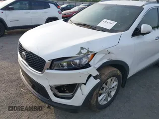 2017 Kia Sorento LX with VIN 5XYPG4A35HG205801, listed as a IAAI auction lot 42143064 with 129,647 mi miles. Bid and sale history available at carsss.com. Image 6.