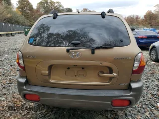 2001 Hyundai Santa Fe GLS with VIN KM8SC83D71U084837, listed as a Copart auction lot 77588984 with 102,585 mi miles and Salvage Title. Bid and sale history available at carsss.com. Image 6.