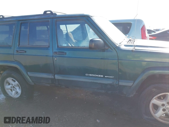 1999 Jeep Cherokee Sport with VIN 1J4FT68S6XL579735, listed as a IAAI auction lot 41484413 with 146,862 mi miles and . Bid and sale history available at DreamBid. Image 12.