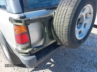 1995 Isuzu Rodeo z VIN 4S2CM58V4S4363500, wystawiony jako IAAI lot #41821801 z przebiegiem 94 480 mil mil oraz . Historia ofert i sprzedaży dostępna na DreamBid. Obrazek 13.