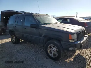 1997 Jeep Grand Cherokee Limited with VIN 1J4GZ78Y1VC563890, listed as a Copart auction lot 41910925 with 0 mi miles and Clean Title. Bid and sale history available at carsss.com. Image 4.