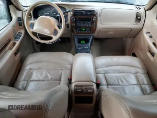 2000 Ford Explorer Limited with VIN 1FMDU75EXYZA76329, listed as a Copart auction lot 80952474 with 90,637 mi miles and Salvage title. Bid and sale history available at DreamBid. Image 8.