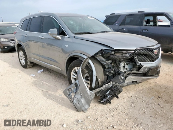 2024 Cadillac XT6 FWD Luxury with VIN 1GYKPAR41RZ700452, listed as a Copart auction lot 57675945 with 27,449 mi miles and Salvage title. Bid and sale history available at DreamBid. Image 4.