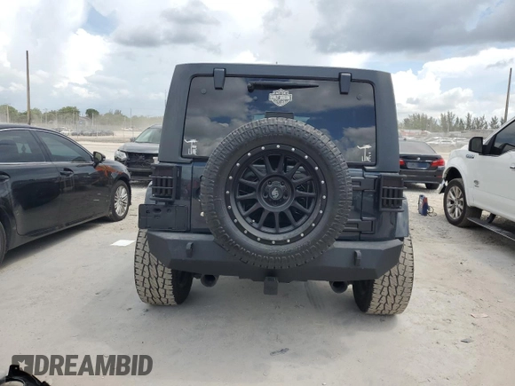 2016 Jeep Wrangler Unlimited Sahara with VIN 1C4HJWEG8GL275844, listed as a Copart auction lot 58997665 with 71,583 mi miles and Salvage title. Bid and sale history available at DreamBid. Image 6.