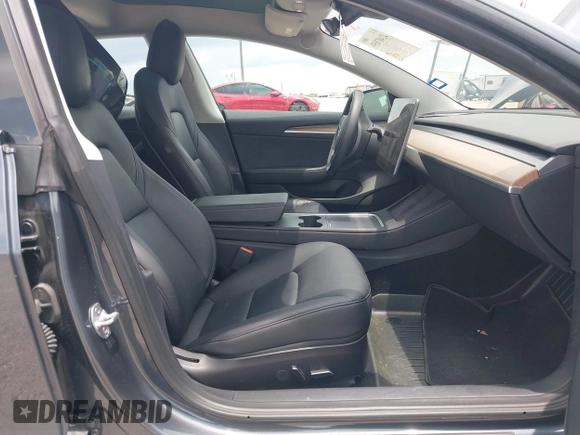 2023 Tesla Model 3 with VIN 5YJ3E1EA7PF417293, listed as a IAAI auction lot 42407659 with 22,578 mi miles and . Bid and sale history available at DreamBid. Image 5.