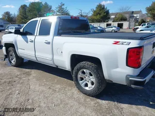 2018 Chevrolet Silverado 1500 LT with VIN 1GCVKREC5JZ350034, listed as a IAAI auction lot 41649277 with 112,673 mi miles. Bid and sale history available at carsss.com. Image 3.