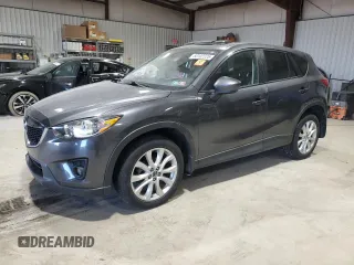 2014 Mazda CX-5 Grand Touring with VIN JM3KE4DY3E0337732, listed as a Copart auction lot 50102235 with 143,109 mi miles and Salvage Title. Bid and sale history available at carsss.com. Image 1.