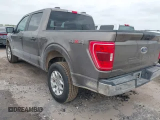 2023 Ford F-150 XL with VIN 1FTFW1E81PFB71702, listed as a IAAI auction lot 42102699 with 57,007 mi miles. Bid and sale history available at carsss.com. Image 3.