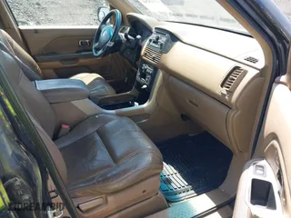 2004 Honda Pilot EX with VIN 2HKYF18524H546430, listed as a IAAI auction lot 42060241 with 126,931 mi miles. Bid and sale history available at carsss.com. Image 5.