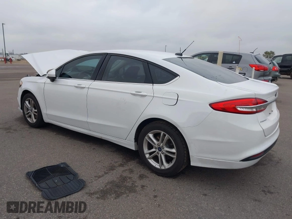 2018 Ford Fusion SE z VIN 3FA6P0H73JR212616, wystawiony jako IAAI lot #40869945 z przebiegiem 142 355 mil mil oraz . Historia ofert i sprzedaży dostępna na DreamBid. Obrazek 3.