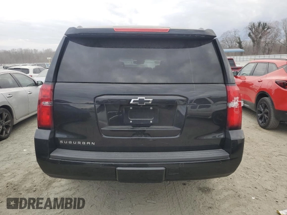 2019 Chevrolet Suburban LT with VIN 1GNSCHKC8KR127431, listed as a Copart auction lot 43931515 with 123,338 mi miles and Salvage Title. Bid and sale history available at DreamBid. Image 6.