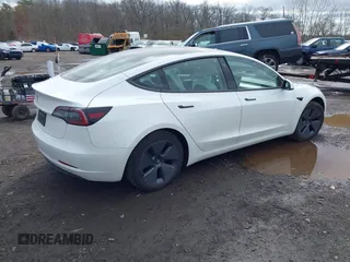 2023 Tesla Model 3 z VIN 5YJ3E1EA8PF671613, wystawiony jako IAAI lot #41737438 z przebiegiem 21 405 mil mil oraz . Historia ofert i sprzedaży dostępna na DreamBid. Obrazek 4.